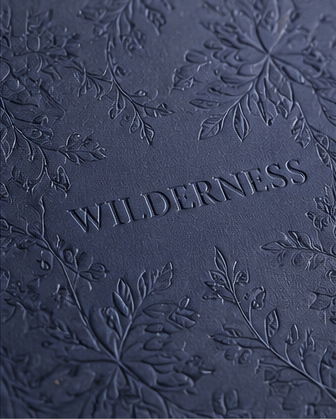 Premium coffee table book featuring embossing and debossing effects on the cover